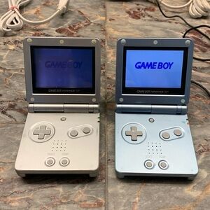Two Nintendo Game Boy advance SP systems one charger, 14 games bundle.